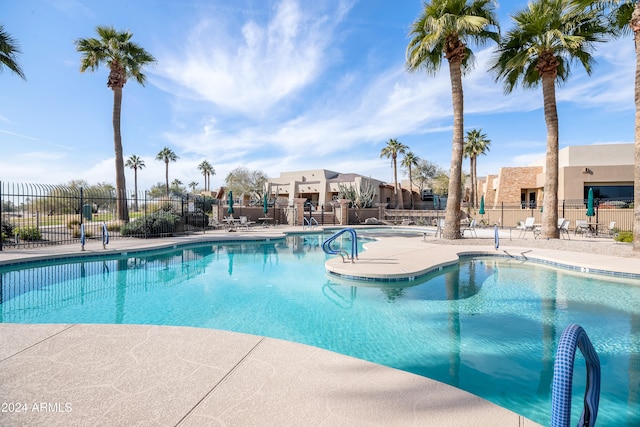 view of swimming pool with a patio area