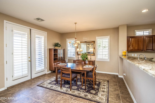 dining area featuring an inviting chandelier