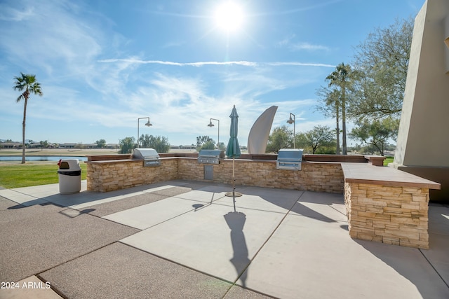 view of patio with an outdoor kitchen and area for grilling