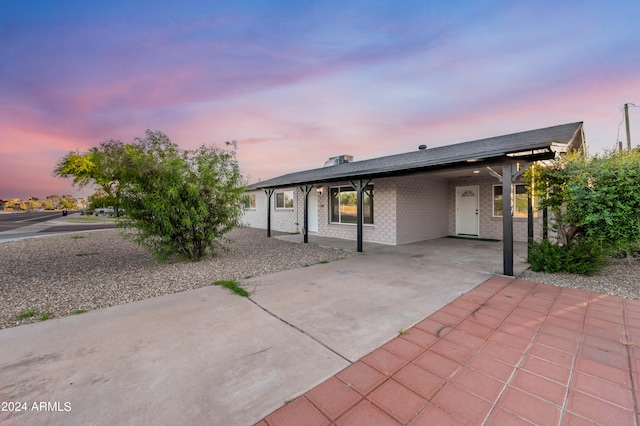 view of front of home featuring a carport