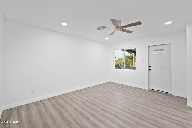 entryway with ceiling fan and light hardwood / wood-style floors