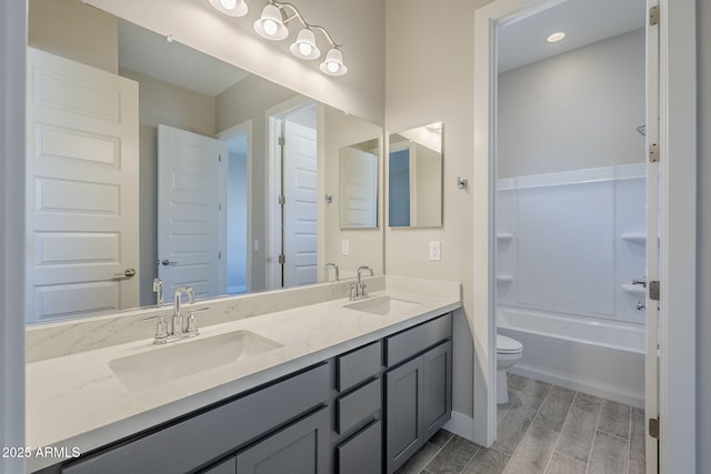 full bathroom with vanity, toilet, and shower / bath combination