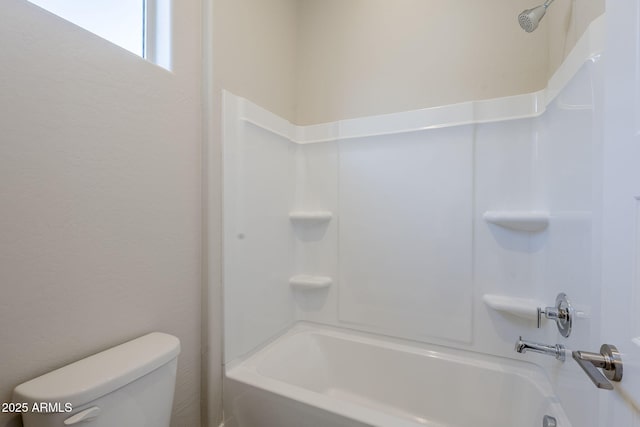 bathroom featuring toilet and shower / bath combination