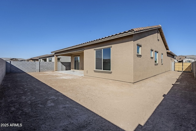 rear view of house featuring a patio area