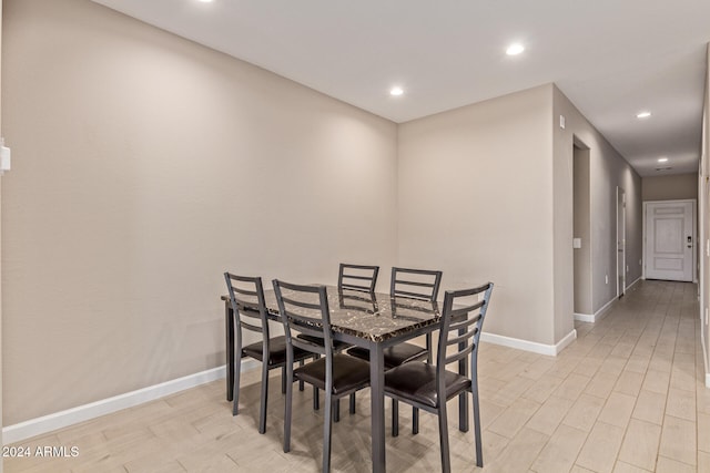 dining area with light hardwood / wood-style floors