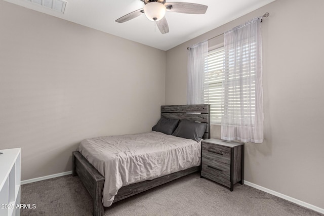 bedroom with ceiling fan and light colored carpet