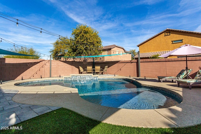 view of swimming pool with a patio