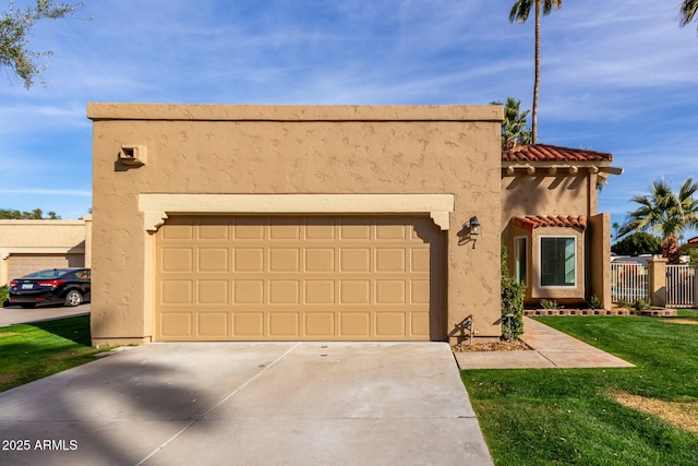 view of front of home featuring concrete driveway, stucco siding, a tile roof, an attached garage, and a front yard