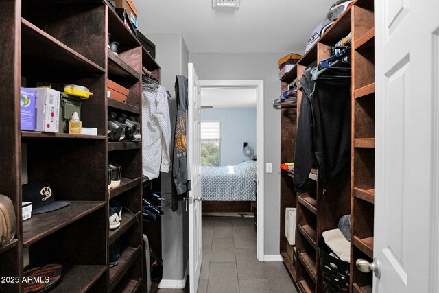 walk in closet featuring tile patterned floors
