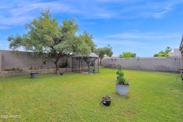 view of yard with a fenced backyard
