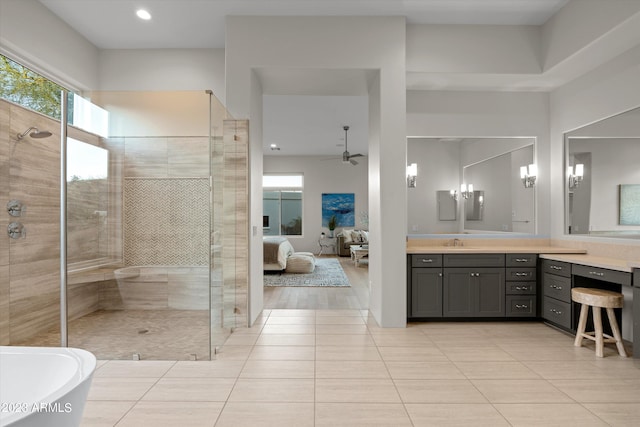 bathroom with vanity, hardwood / wood-style flooring, separate shower and tub, and ceiling fan