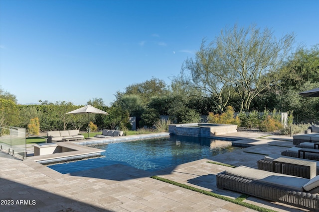 view of pool with a patio and an in ground hot tub