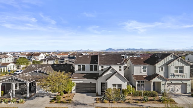 bird's eye view with a mountain view and a residential view