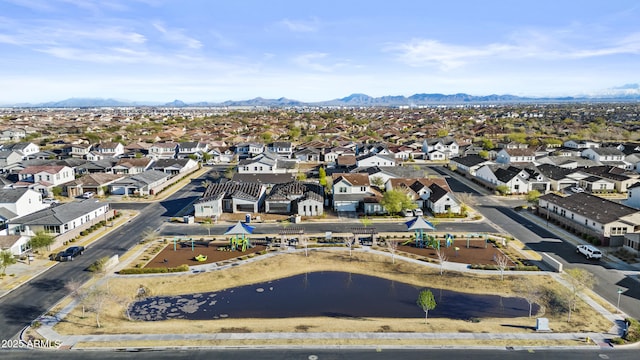 bird's eye view with a residential view and a water and mountain view