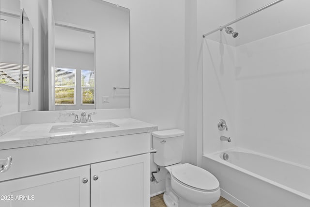 full bath with vanity, toilet, and shower / bathtub combination