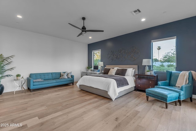 bedroom featuring recessed lighting, visible vents, light wood-style flooring, and a ceiling fan