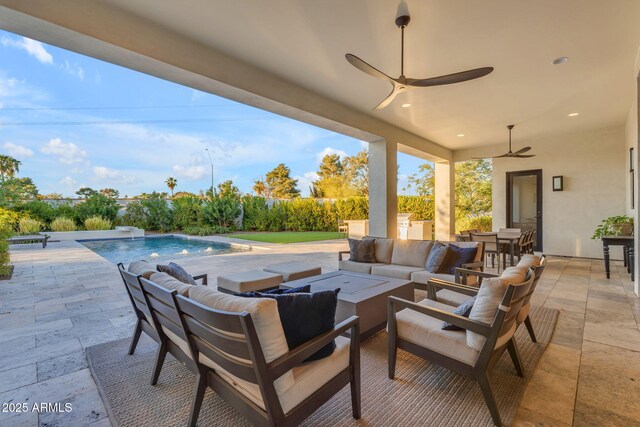 view of patio / terrace with a fenced in pool and an outdoor hangout area