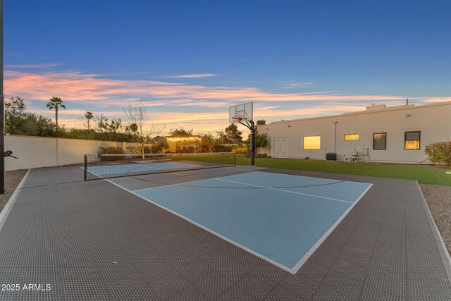 view of tennis court with fence