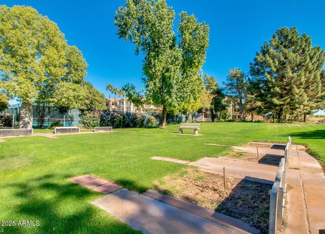9733 W Mcrae Way, Peoria, AZ 85382 - surrounding community with a lawn and a vegetable garden