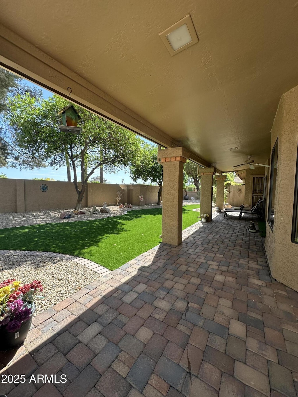 view of patio with ceiling fan and a fenced backyard