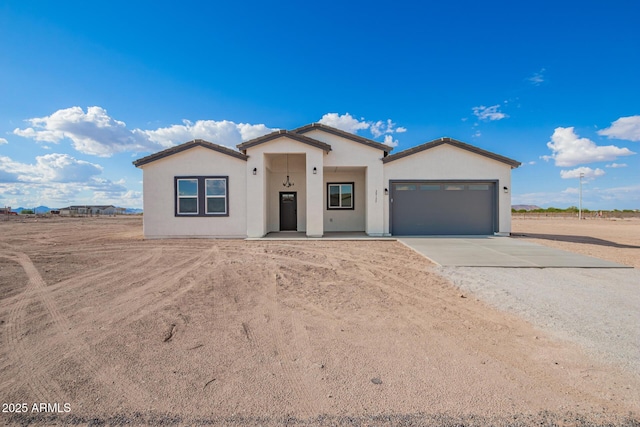38132 W Solano Dr, Tonopah, AZ 85354 - single story home with driveway, a garage, and stucco siding