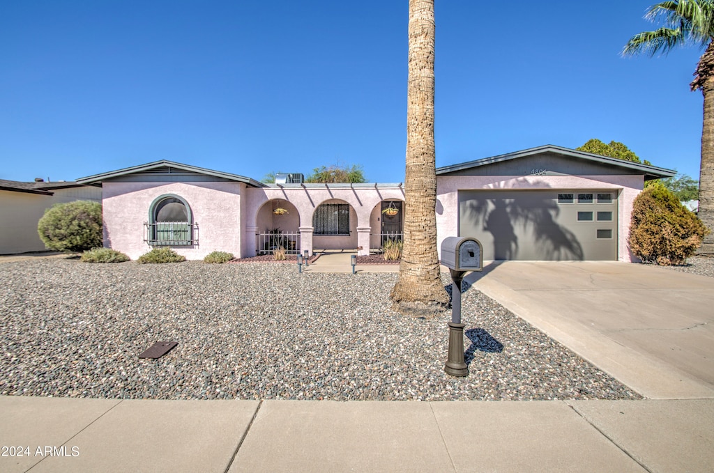 ranch-style home featuring a garage