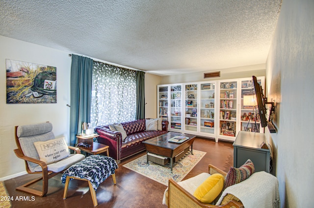 living room featuring a textured ceiling