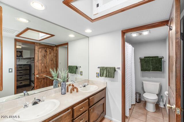 25 Edgewood Cir, Sedona, AZ 86336 - bathroom with double vanity, toilet, recessed lighting, and tile patterned flooring