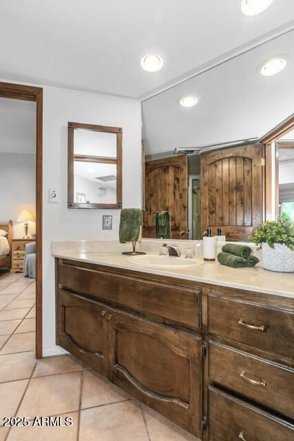 25 Edgewood Cir, Sedona, AZ 86336 - ensuite bathroom featuring vanity, tile patterned flooring, and recessed lighting