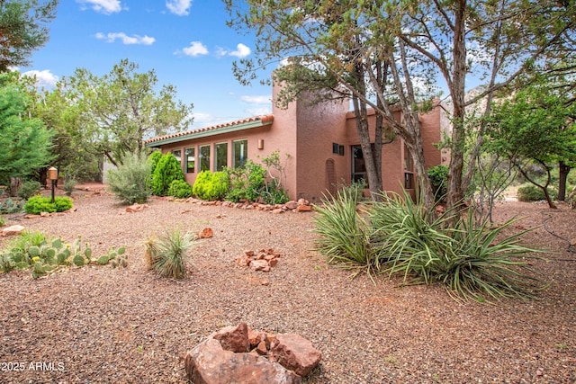 25 Edgewood Cir, Sedona, AZ 86336 - back of property with stucco siding and a tile roof