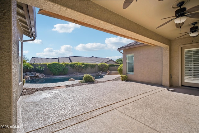 2207 W Hidden Treasure Way, Phoenix, AZ 85086 - fenced backyard featuring ceiling fan and a patio area