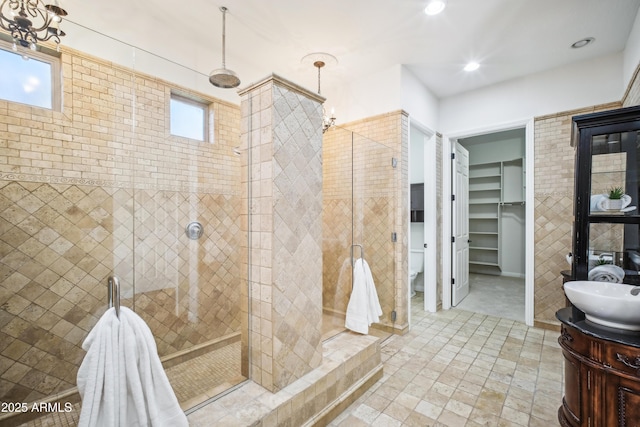 2207 W Hidden Treasure Way, Phoenix, AZ 85086 - bathroom with a stall shower, vanity, a chandelier, and recessed lighting