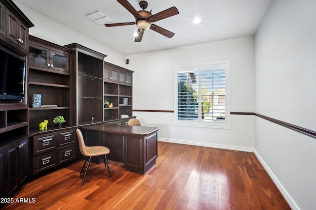 2207 W Hidden Treasure Way, Phoenix, AZ 85086 - office space featuring ceiling fan, wood finished floors, and built in desk