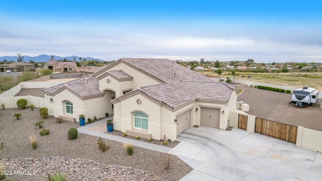 view of front of home featuring a mountain view and a garage