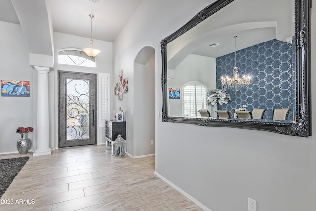 foyer entrance featuring ornate columns