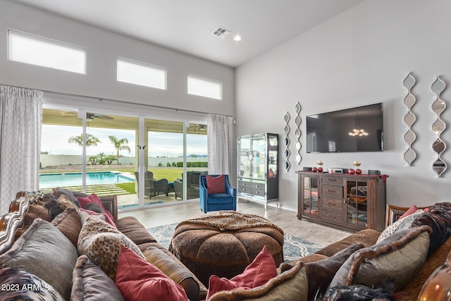 tiled living room with a towering ceiling