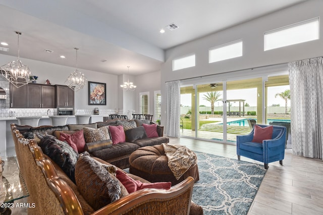 living room featuring a notable chandelier