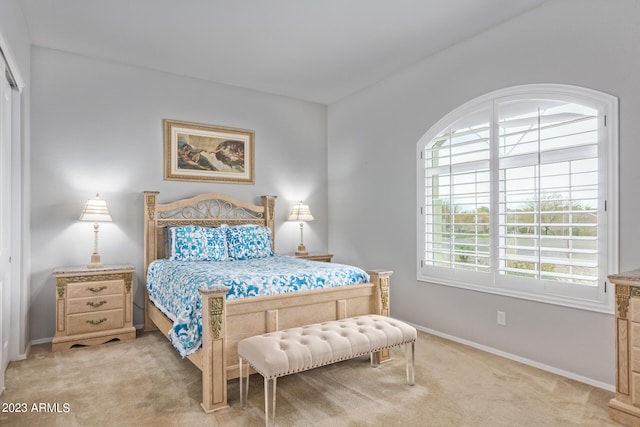 bedroom with light carpet