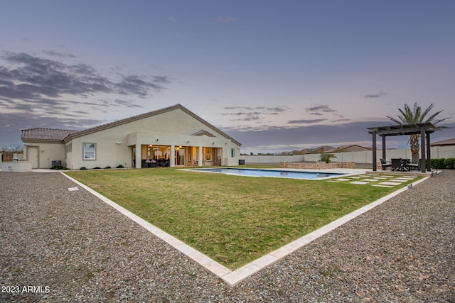 view of front of house featuring a yard and a patio