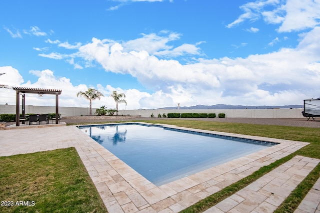 view of pool featuring a lawn, a patio, and a pergola