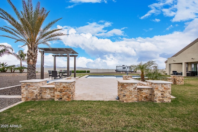 exterior space with a pergola, area for grilling, and a patio area