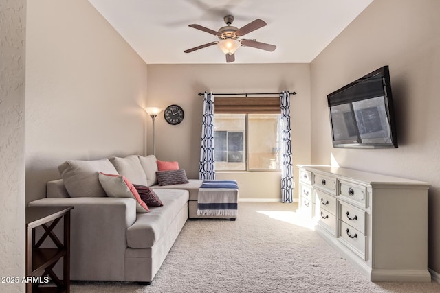 carpeted living room featuring ceiling fan