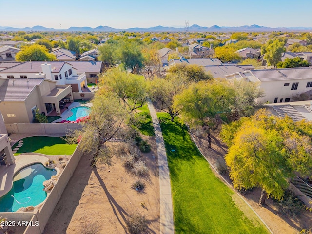 birds eye view of property featuring a mountain view