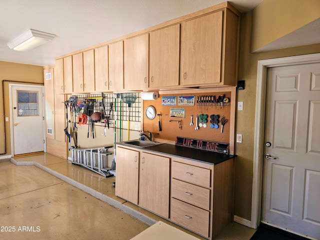 kitchen with light brown cabinets and sink