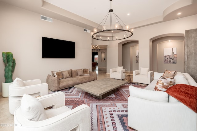 living room with a notable chandelier