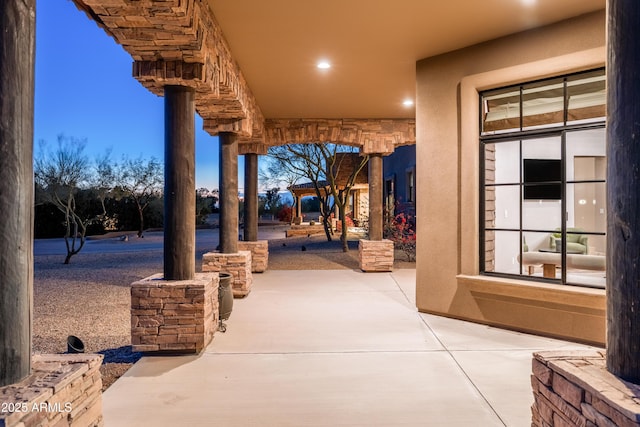 view of patio terrace at dusk