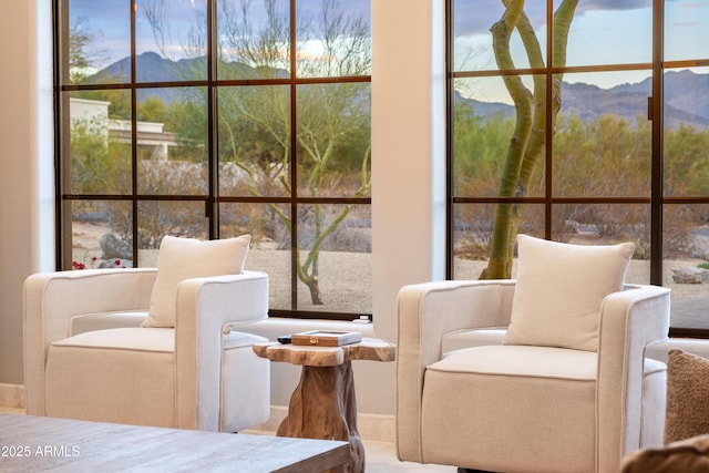 sunroom featuring a mountain view