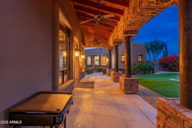 patio terrace at dusk with ceiling fan