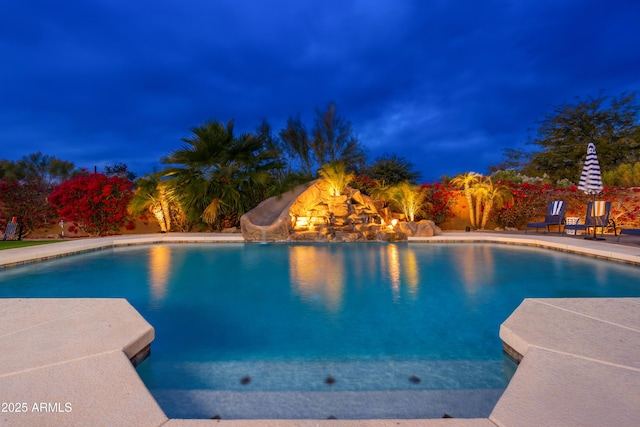 view of swimming pool featuring a water slide