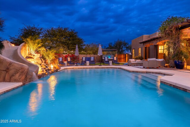 view of swimming pool featuring an outdoor living space and a patio area